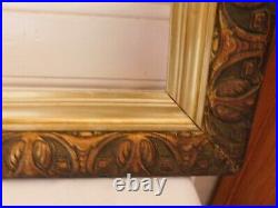 Ancien cadre bois stuqué doré décor stylisé art déco 50.5 x 69.5 cm