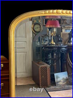 Miroir Ancien Époque Art Déco En Bois / Stuc Doré Surmonté D'une Frise De Fleurs Miroir Ancien Époque Art Déco En Bois / Stuc Doré Surmonté D'une Frise De Fleurs