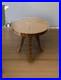 Une_table_ronde_Art_deco_en_palissandre_et_bois_d_hetre_avec_motifs_elegants_01_rv